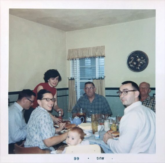 The Houston family eating hamburgers, August 1966