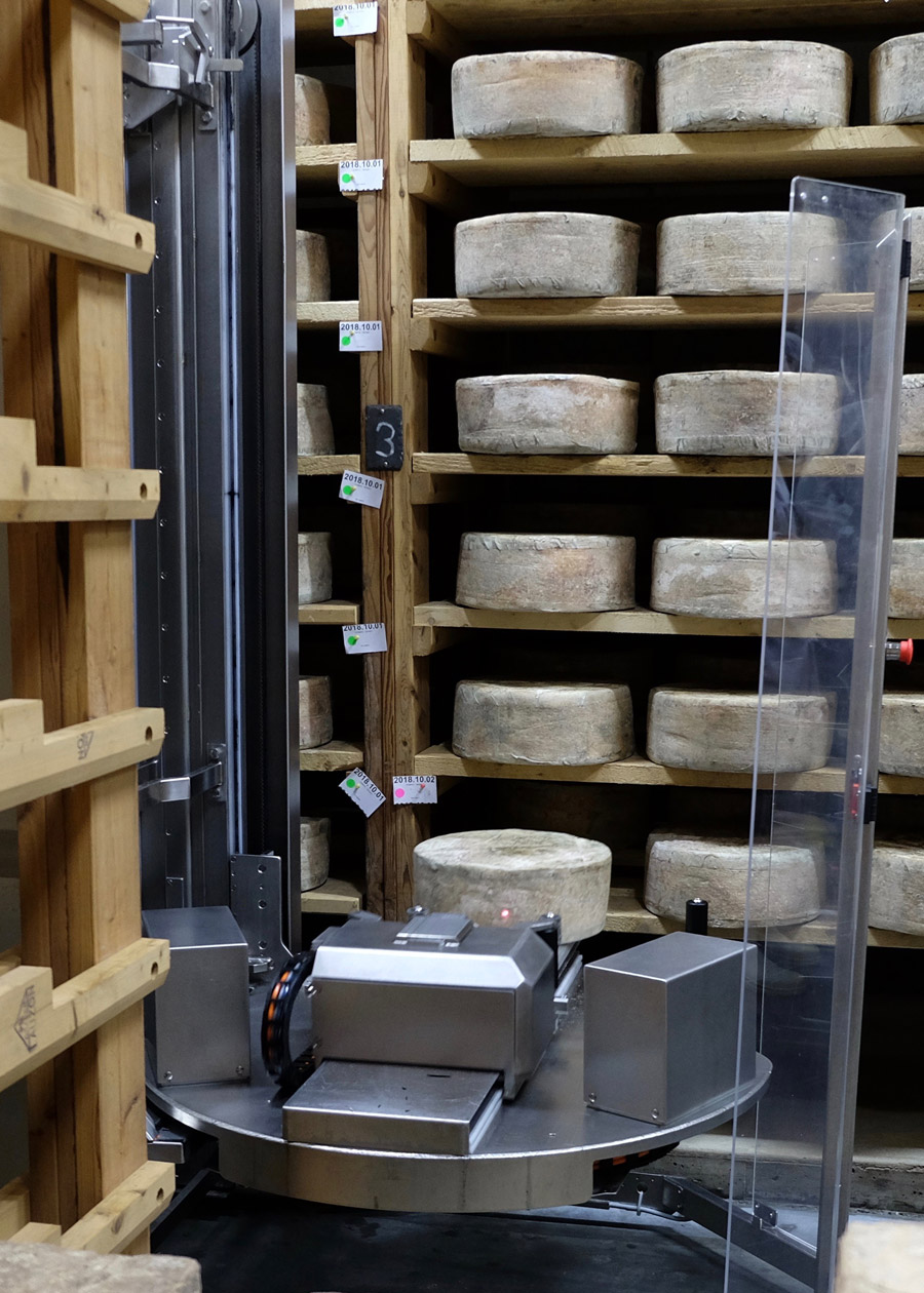 Cellars at Jasper Hill uses a robot to turn and brush the cheeses